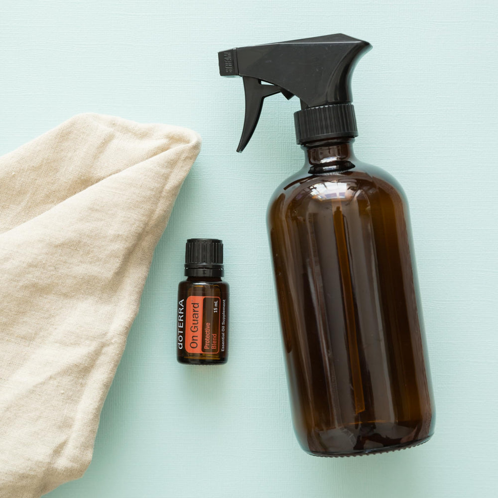 doTERRA On Guard surface cleaning concept shown with spray bottle