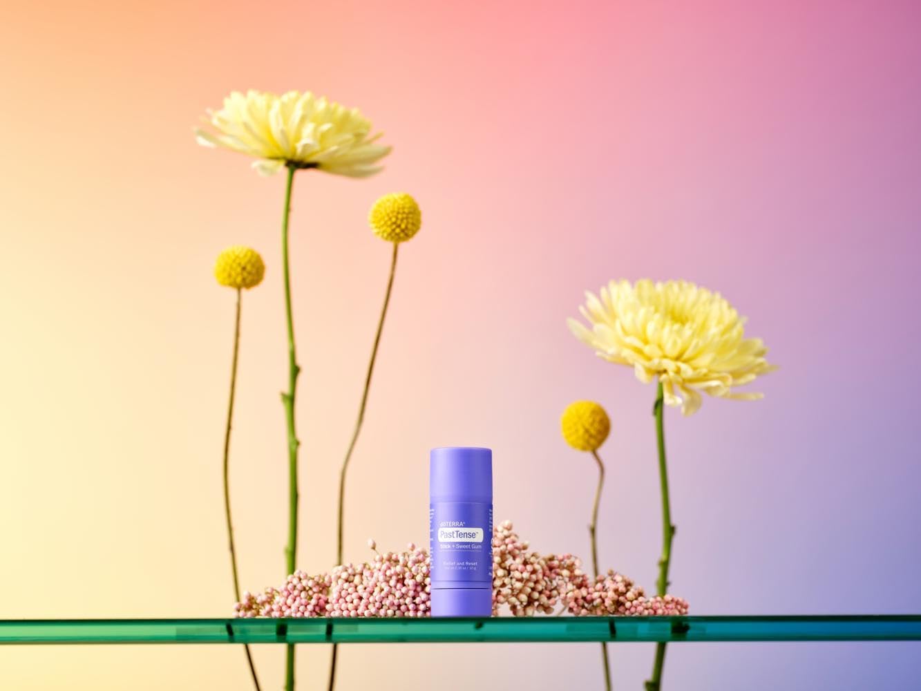 doTERRA PastTense Stick + Sweet Gum applied to temples for calming comfort.