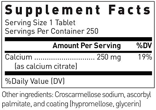 Close-up of Douglas Laboratories Calcium Citrate tablets poured from bottle for daily use.