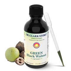 Dr. Clark Store green-black walnut hull tincture bottle on desk for daily digestive balance.