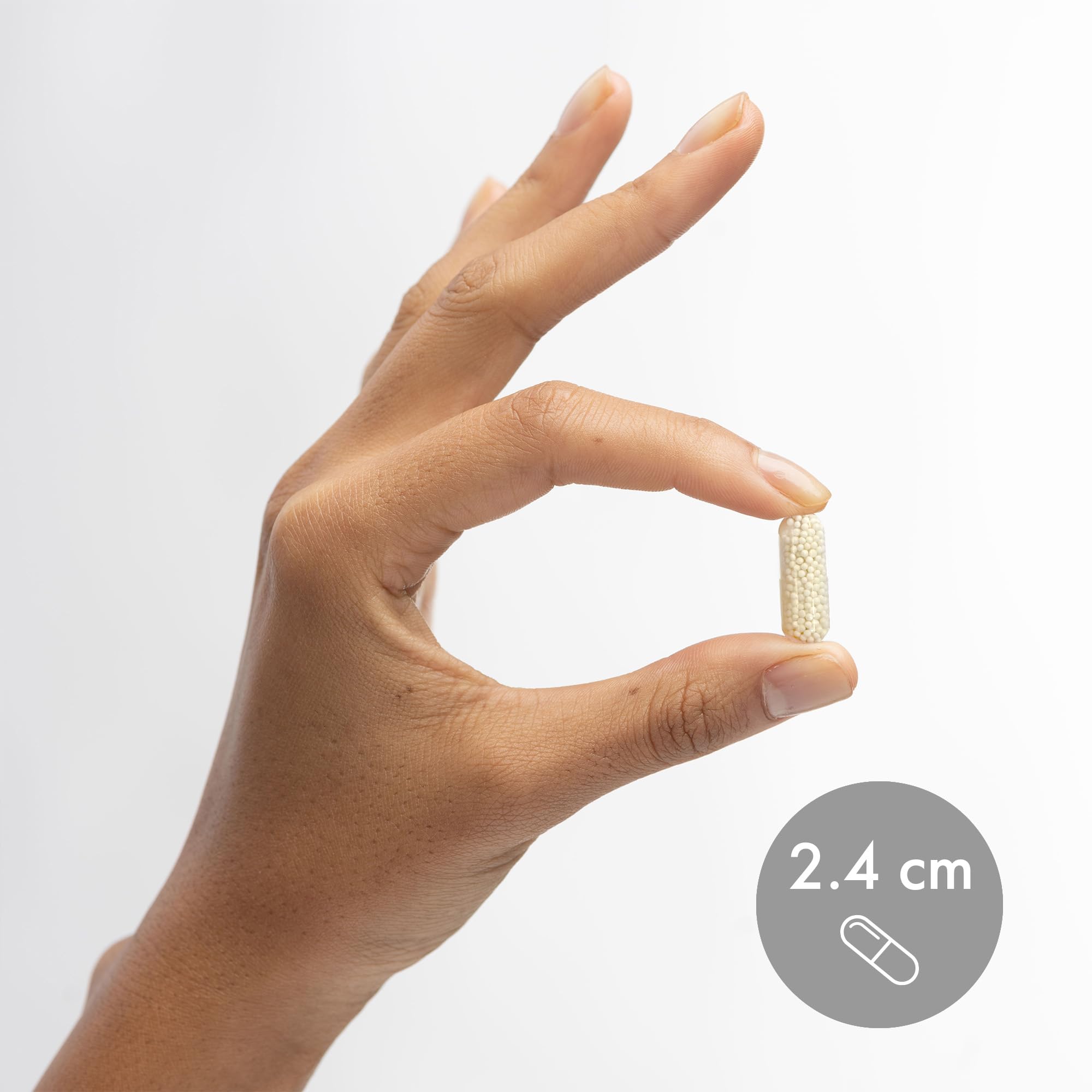 Capsules with glass of water ready for daily intake.