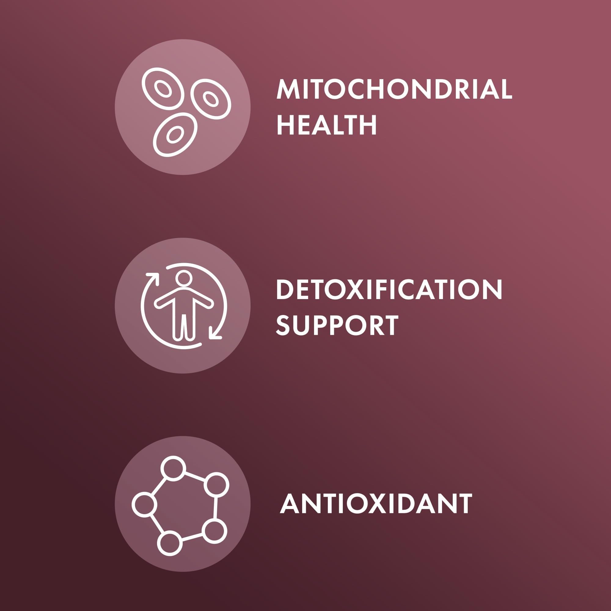 Dr. Mercola NAC with Milk Thistle capsules beside a glass of water.
