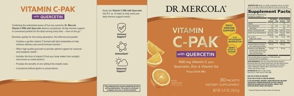 Dr. Mercola Vitamin C-PAK dissolving in water with bright orange fizz and nutrients