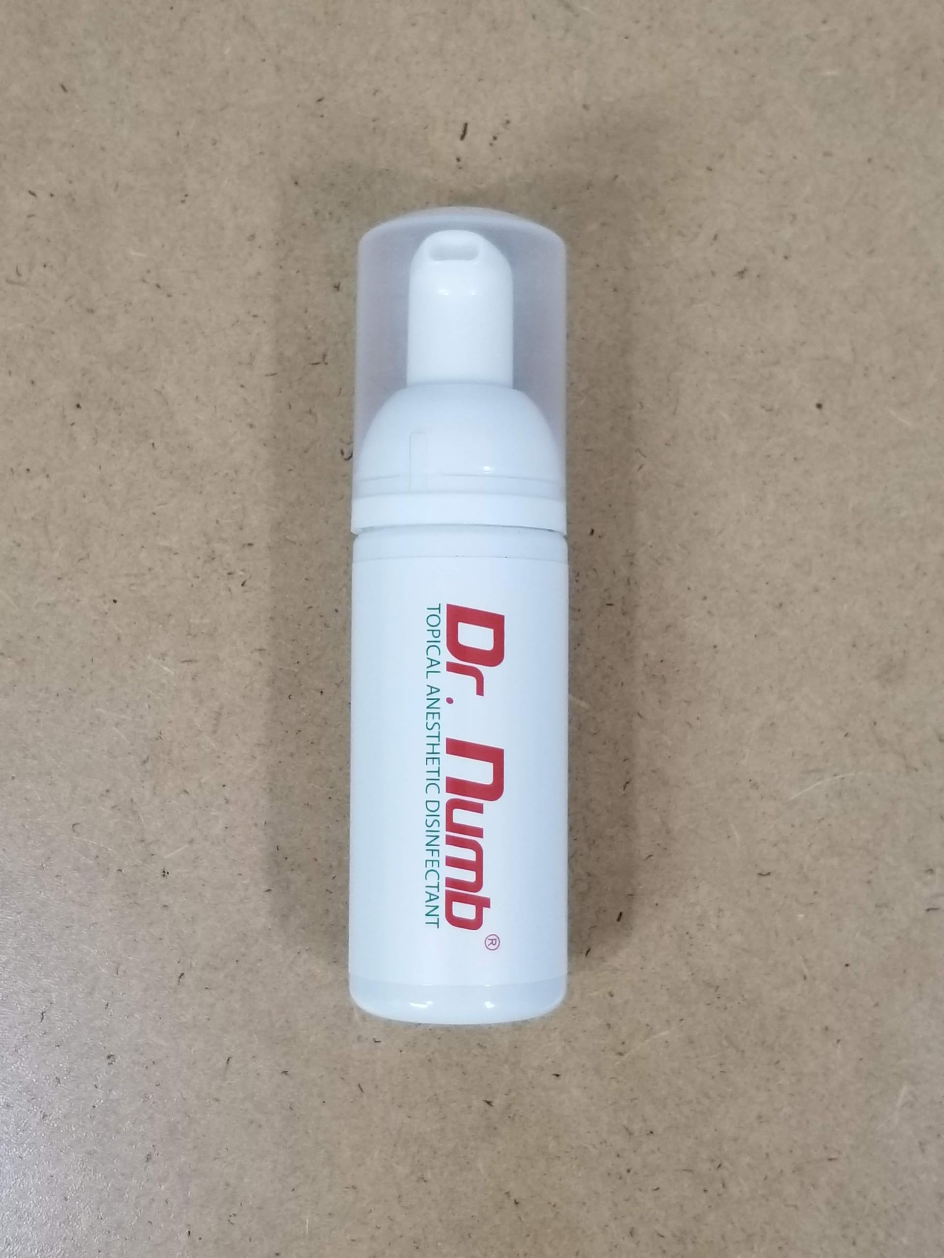 Dr. Numb travel-friendly compact bottle fits in toiletry bag for travel care.
