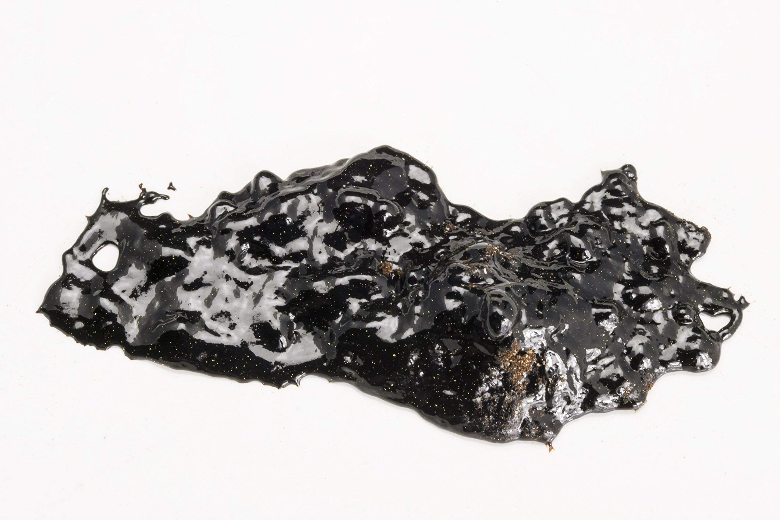 Dragon Herbs High Mountain Shilajit jar with spoon suggests easy mixing.
