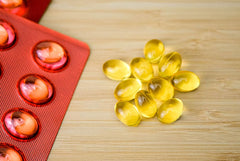Dragon Herbs Reishi Spore Oil golden oil texture seen in softgels.