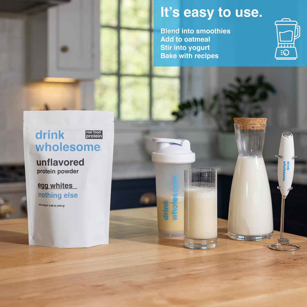 Drink Wholesome shake glass showing dairy-free, gluten-free protein blend in action.