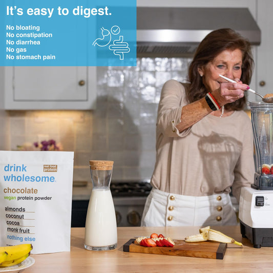 Drizzle of protein powder from the scoop ready to mix.