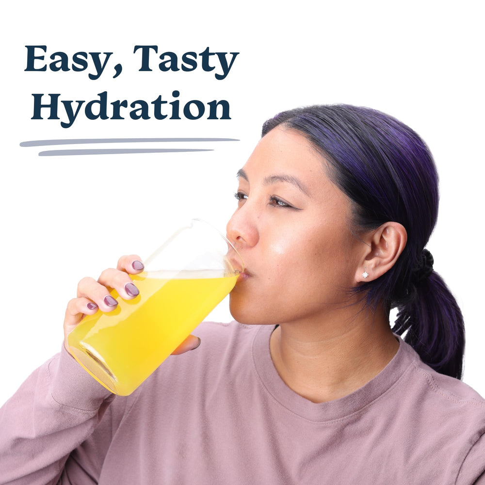 Drinklits daily hydration bundle featuring two Ginger-Lime and two Orange tubes.