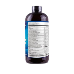 Drs Advantage Liquid Mega Multivitamins bottle pouring into a glass for easy dosing.