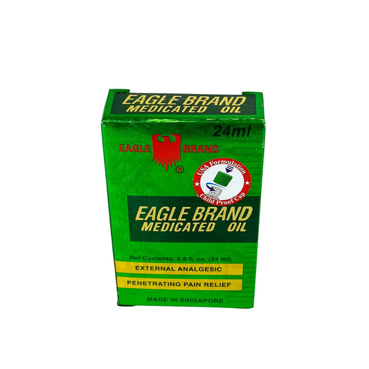Eagle Brand Medicated Oil green oil close-up showing distinctive color for soothing applications