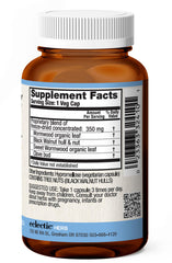 ECLECTIC INSTITUTE ParaFight capsules on counter with herbs for detox support.