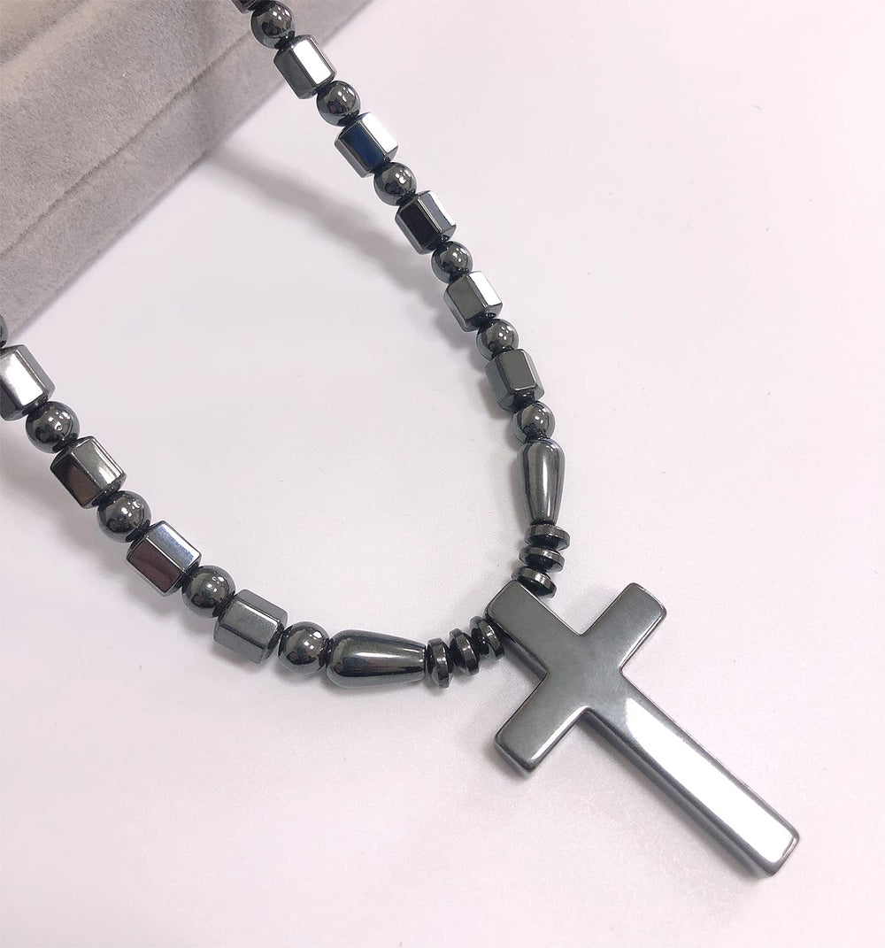 Ecooon cross pendant magnetic closure shown securing the necklace during activity.