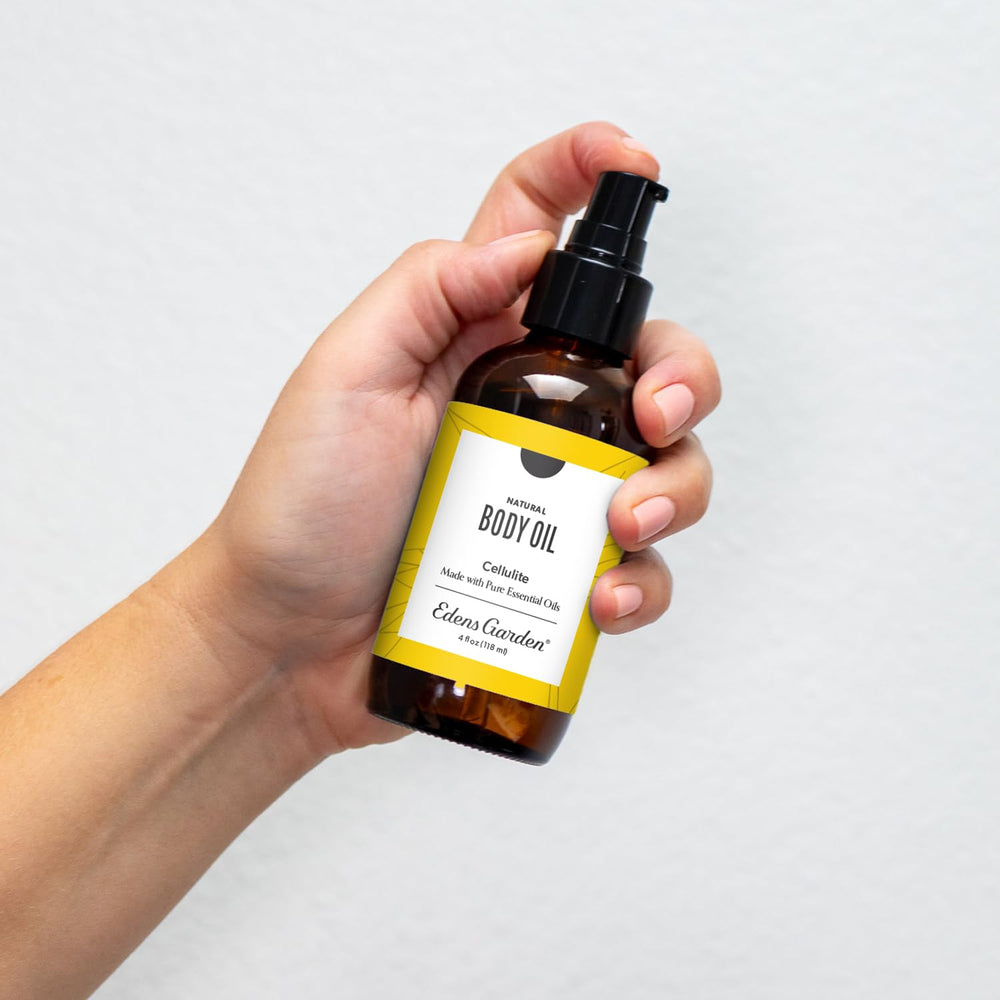 Edens Garden cellulite oil bottle close-up highlighting aroma and luxurious texture