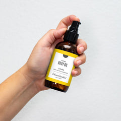 Edens Garden cellulite oil bottle close-up highlighting aroma and luxurious texture