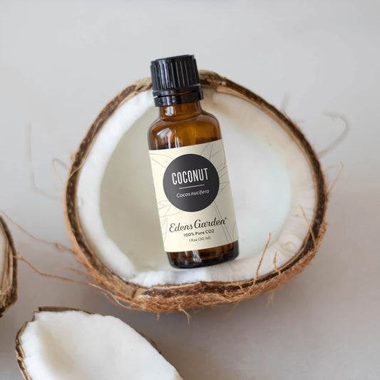 Edens Garden Coconut CO2 Essential Oil bottle, close-up of amber container for premium quality.