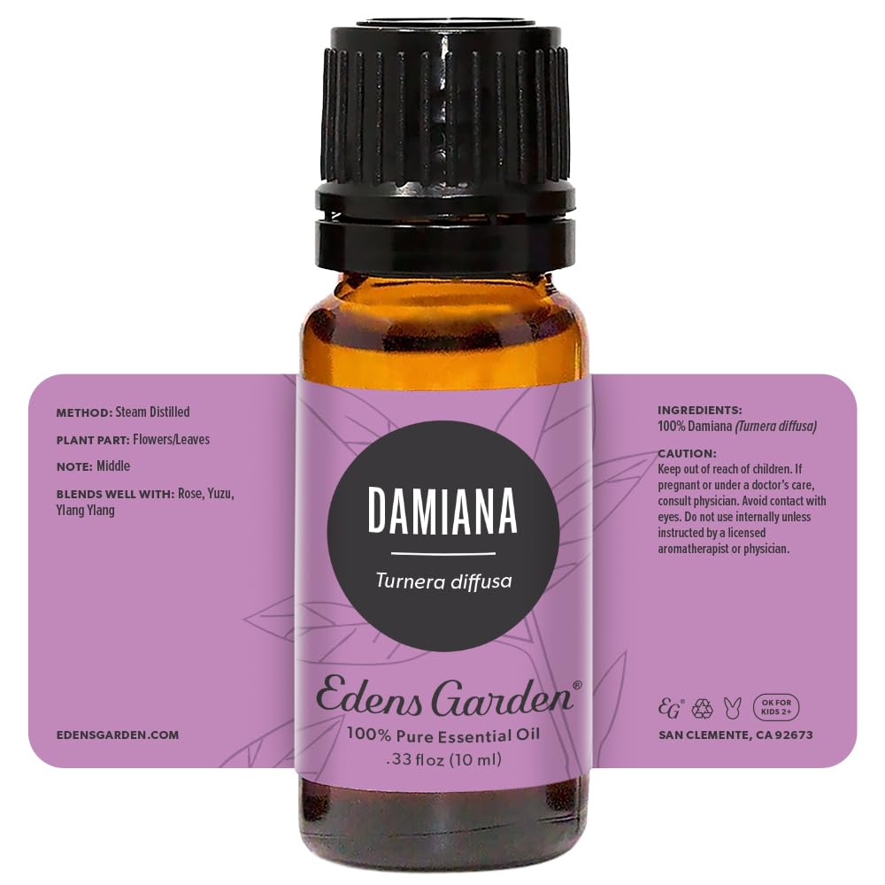 Damiana oil bottle next to diffuser and essential oil setup.