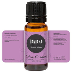Damiana oil bottle next to diffuser and essential oil setup.