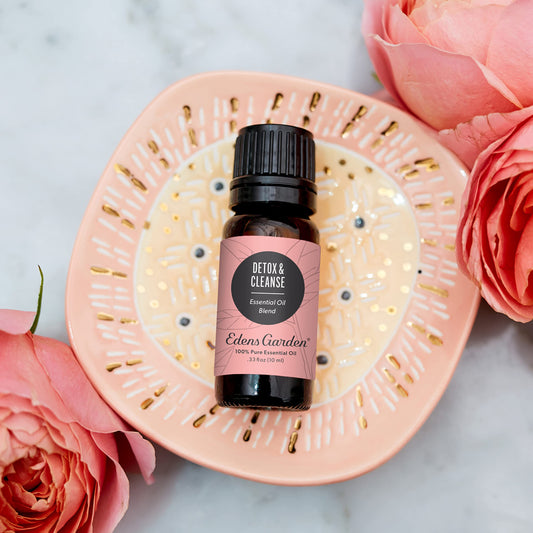 Edens Garden Detox bottle pour showing precise drop application for DIY blends.
