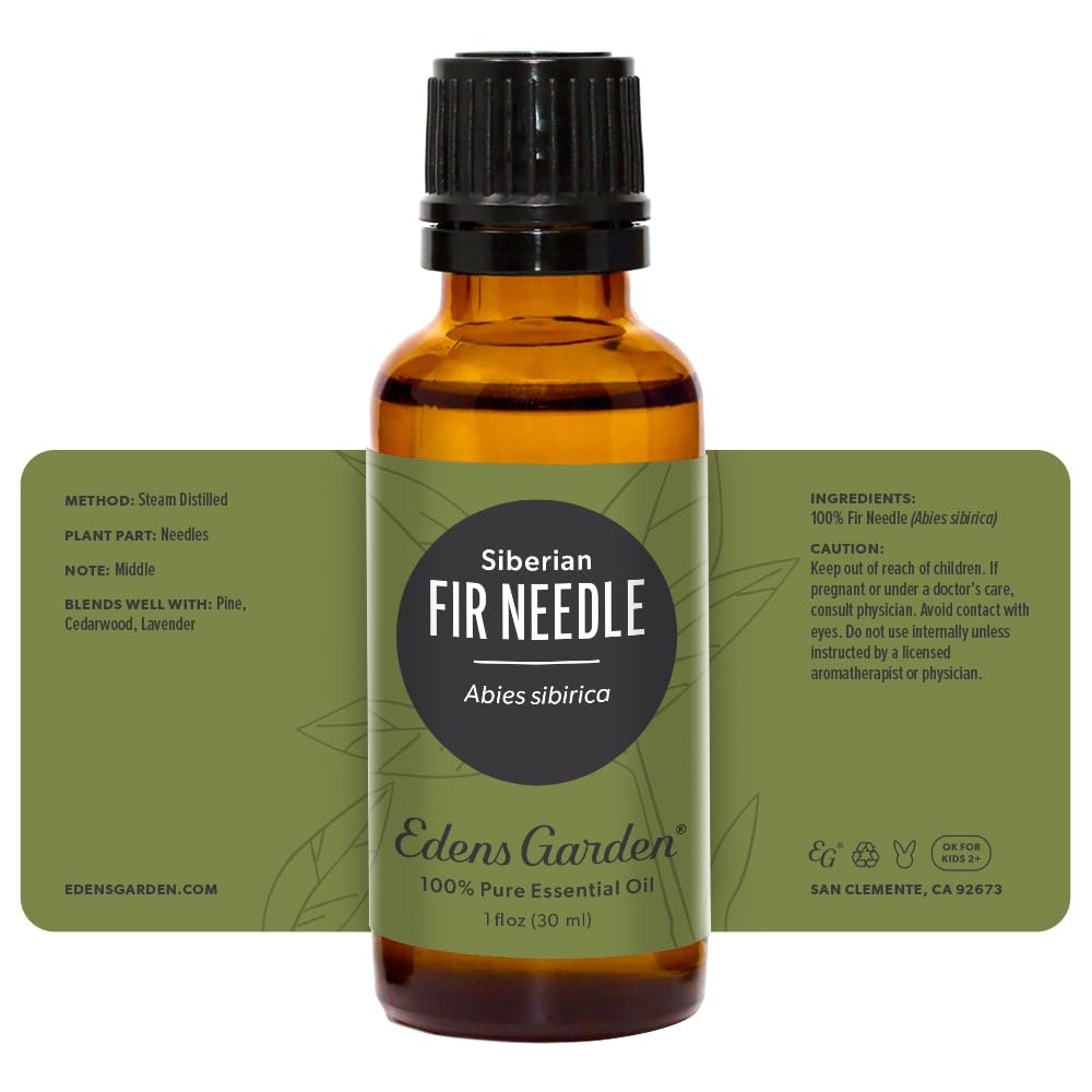 Woodgrain backdrop with Edens Garden Fir Needle Siberian bottle.