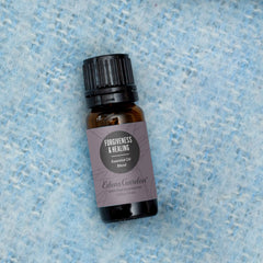 Edens Garden Forgiveness & Healing oil label closeup highlighting purity and ingredients.