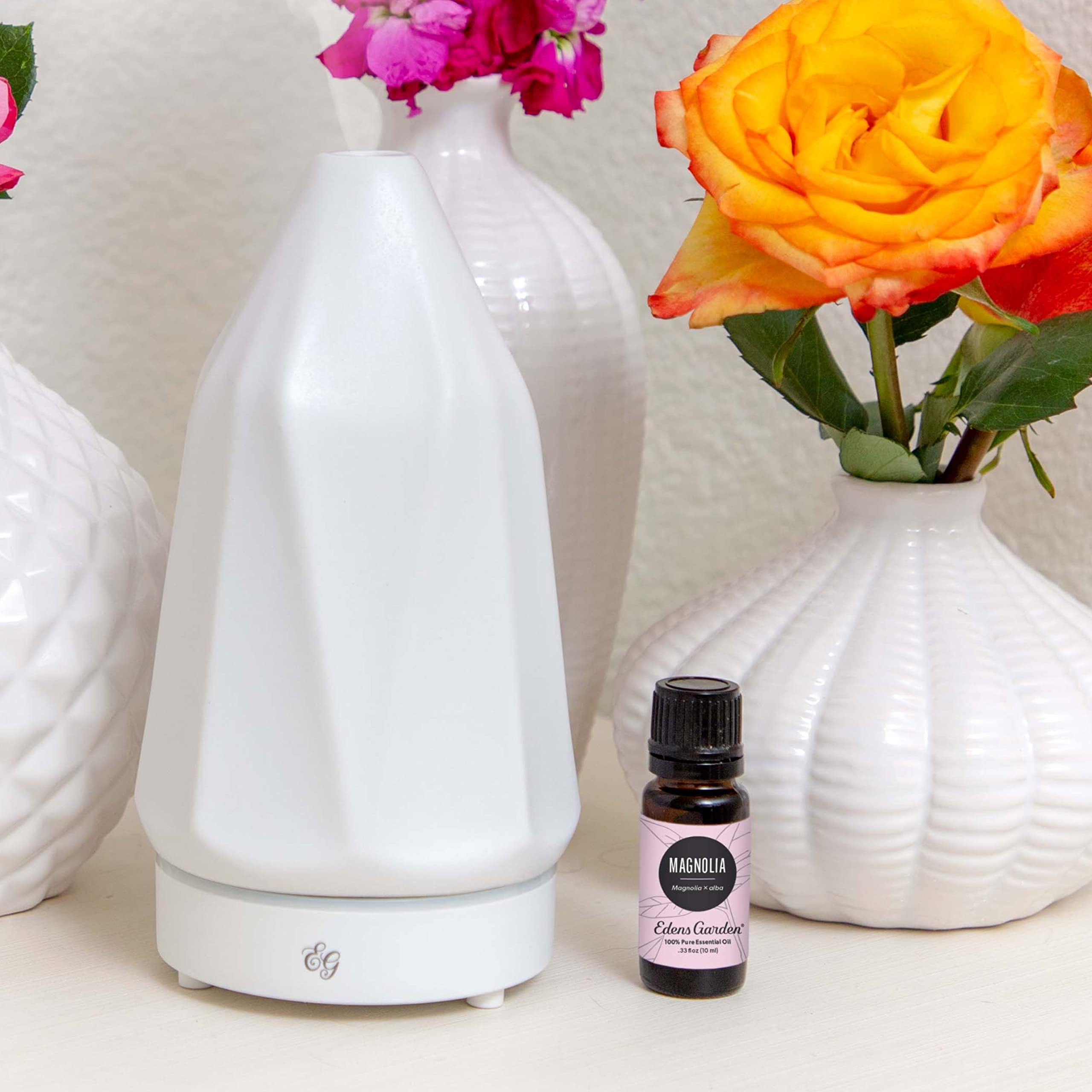 Magnolia essential oil diffuser mist creating a calming floral ambiance