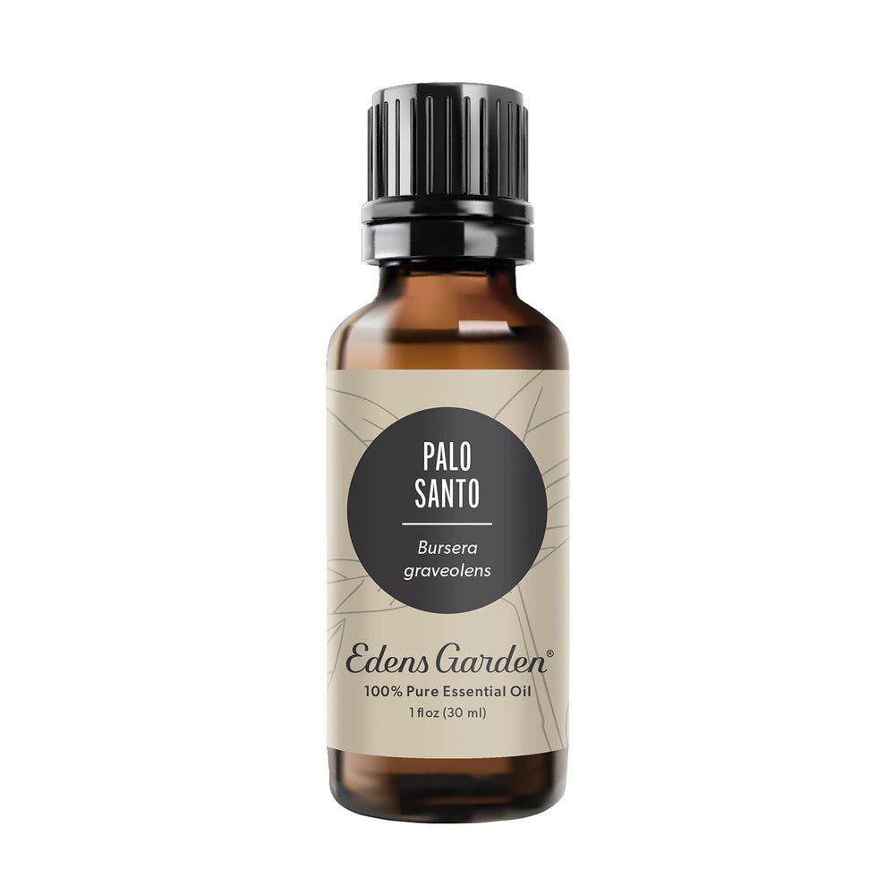 Edens Garden Palo Santo essential oil bottle close-up for calming aromatherapy.
