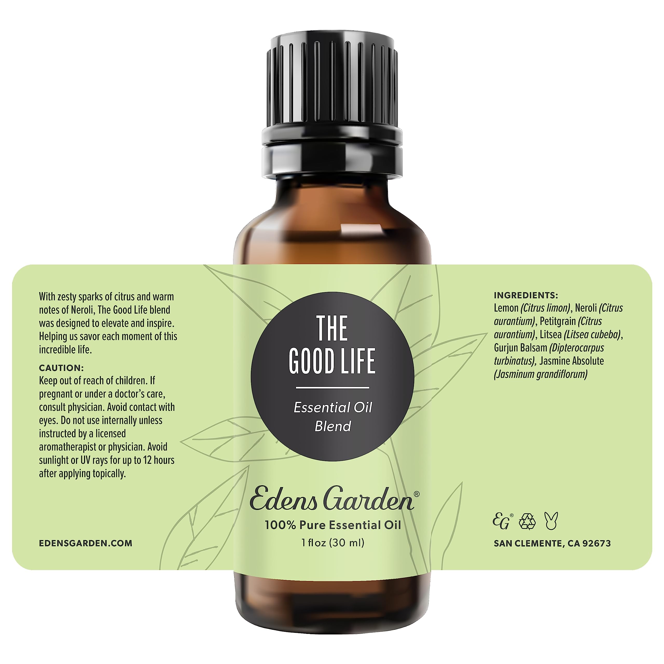 Edens Garden The Good Life diffuser near flowers suggests uplifting ambience for any room.