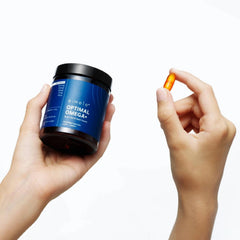 eimele Optimal Omega+ bottle with spoon showing daily intake ritual.