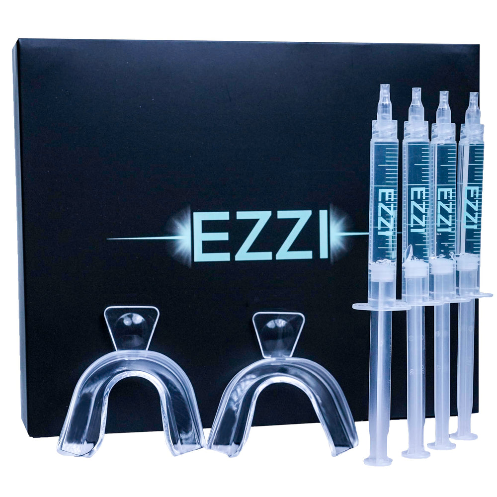 EZZI Teeth Whitening Kit open box with syringes and trays for at-home whitening.