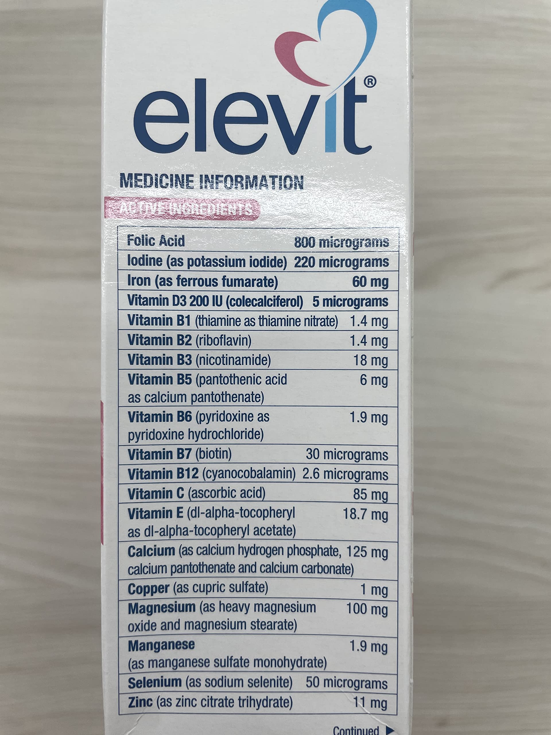 Elevit TAB with Iodine 100s tablet close-up shows compact daily dose.