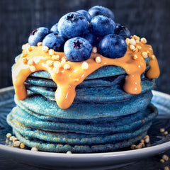 Ellie's Best blue spirulina colors yogurt and bowls for fun, nutritious dishes.
