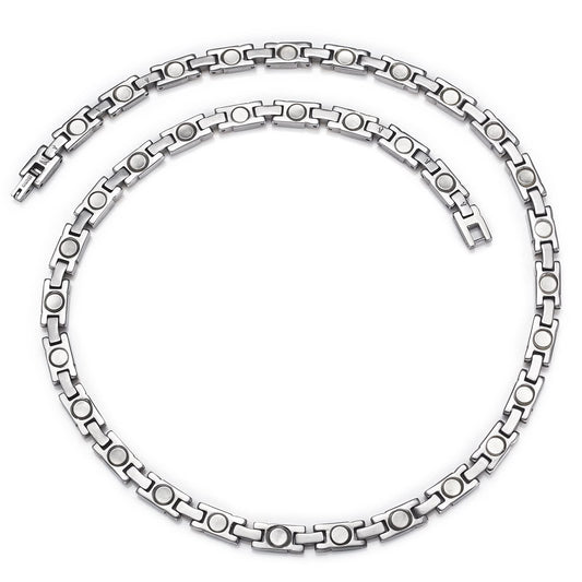 EnerMagiX unisex titanium silver necklace worn by model for versatile style.
