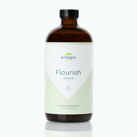 ENTEGRO Flourish Junior bottle on table; premium glass packaging preserves freshness