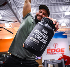 ES FIT protein powder scoop beside the tub emphasizes purity and fast absorption