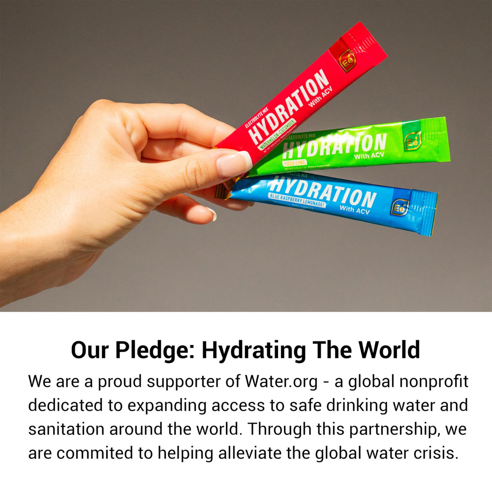 Essential Elements Hydration Packets being stirred into water for quick hydration