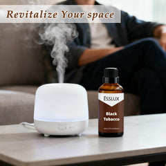 ESSLUX Black Tobacco Fragrance Oil diffuser setup in a living room