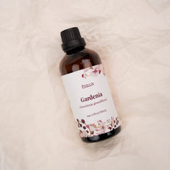 Amber glass bottle of Gardenia oil by ESSLUX with dropper