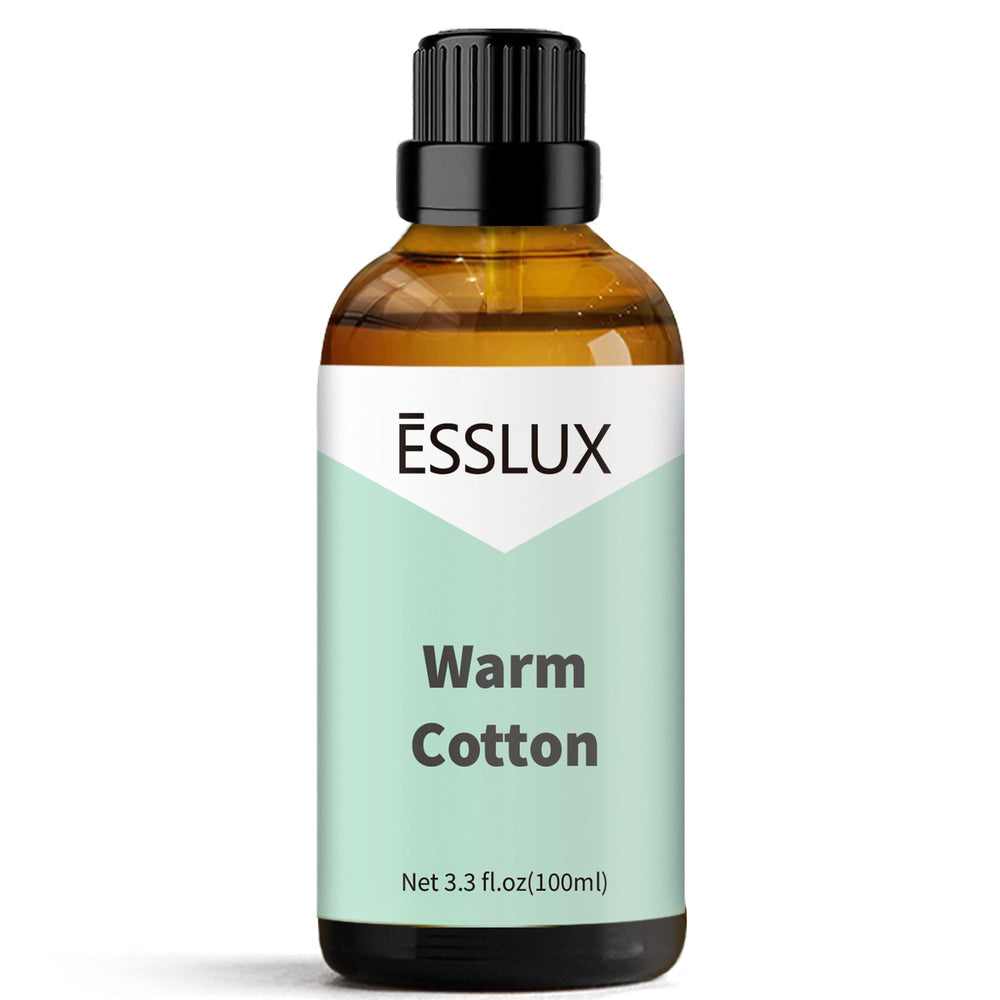 ESSLUX Warm Cotton fragrance oil in a diffuser, creating a calming, fresh ambiance.
