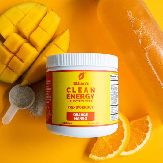 Ethan's Feel Good orange mango powder dissolving in water for steady hydration.