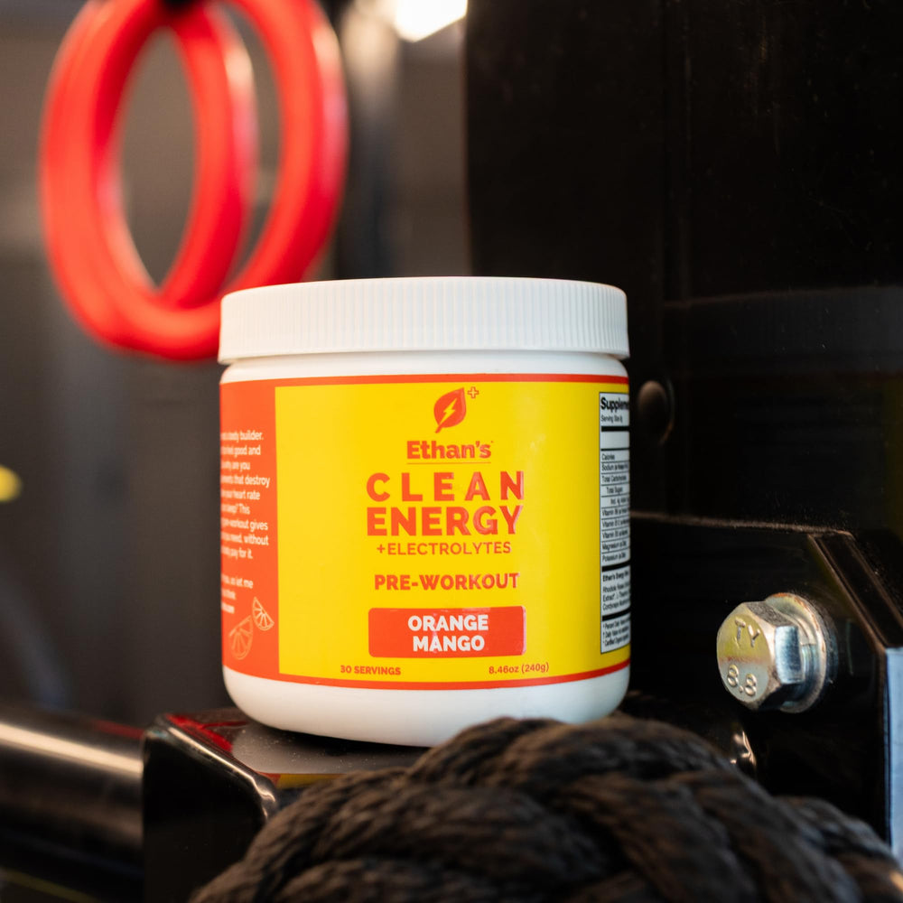 Serving scoop of Ethan's Feel Good orange mango for a quick boost.