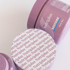 Farmasi Nutriplus Restore mixed in a glass of water for easy consumption.