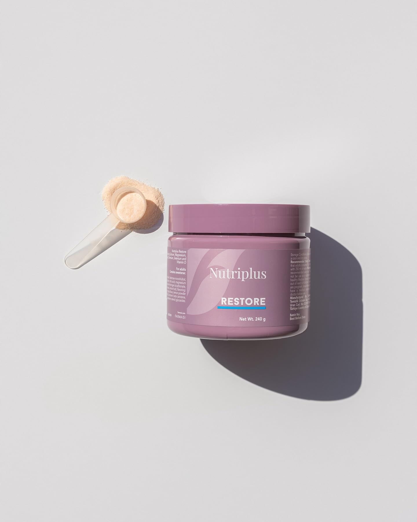 Farmasi Nutriplus Restore fine powder close-up highlighting mineral content.