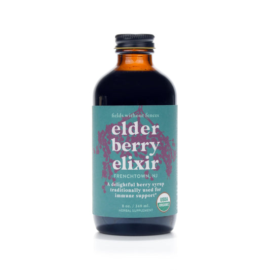 Fields Without Fences Elderberry Elixir bottle with label, highlighting organic elderberries for daily wellness ritual.