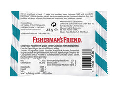 Person with pocket-sized Fisherman's Friend Spearmint tin during travel for on-the-go freshness.