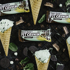 Fit Crunch bar cross-section reveals soft cake core under a crisp outer layer.