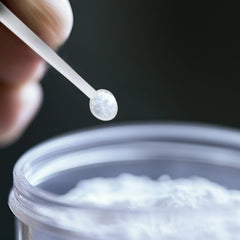 Measuring cup with FitPowders Phenylethylamine powder for accurate dosing
