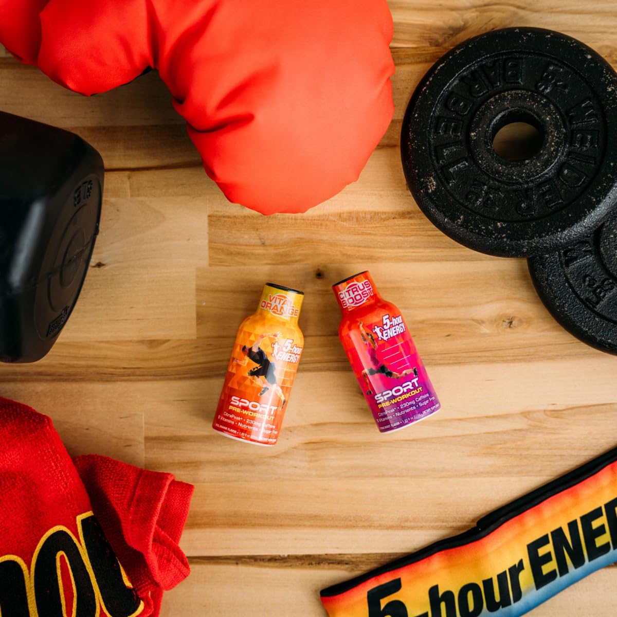 Five-Hour Energy sport shot beside gym gear suggests quick energy.