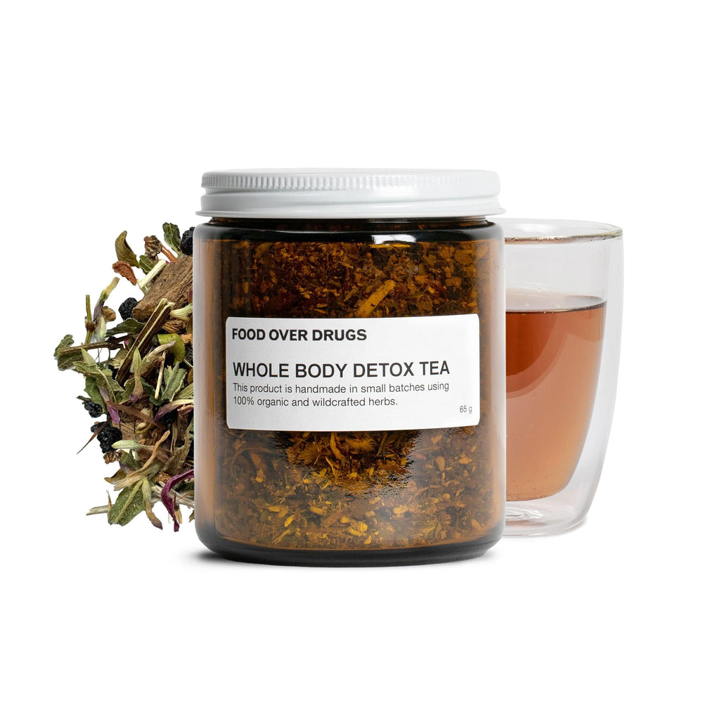 Food Over Drugs detox tea loose-leaf blend in a glass jar for daily wellness.