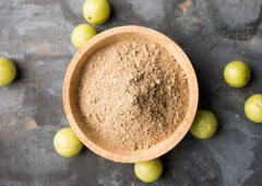 Food to Live amla powder dusty jar closeup highlights quality